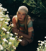 Model wearing a crochet hat from the A Sun Diaries collection by SER by Andrea Agudelo