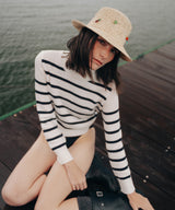 Model wearing a natural woven sun hat from the A Sun Diaries collection by SER by Andrea Agudelo
