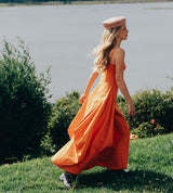 Model wearing a pink woven hat from the A Sun Diaries collection by SER by Andrea Agudelo