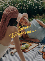 Models wearing woven hats from the A Sun Diaries collection by SER by Andrea Agudelo