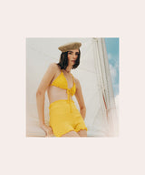 Model wearing a natural woven beret from the A Sun Diaries collection by SER by Andrea Agudelo